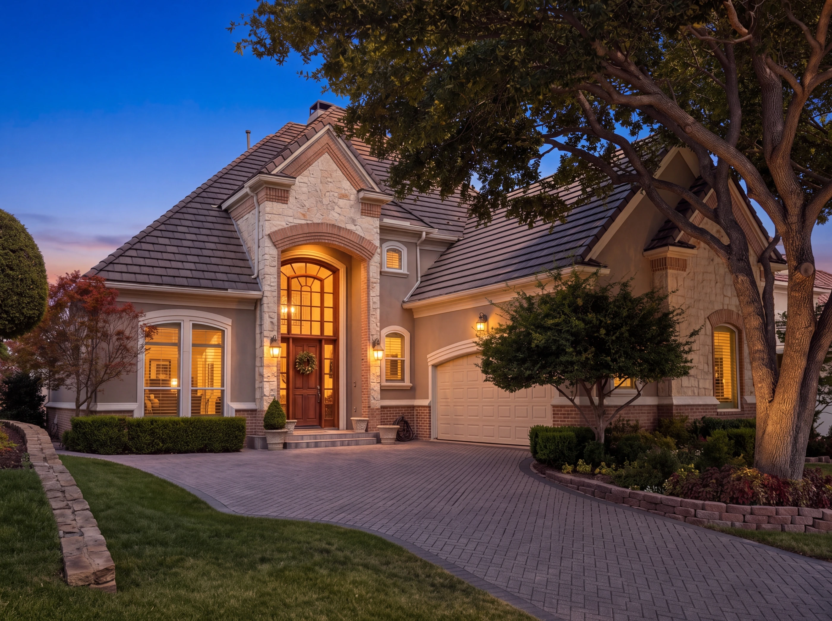 Stone and stucco elevation at dusk