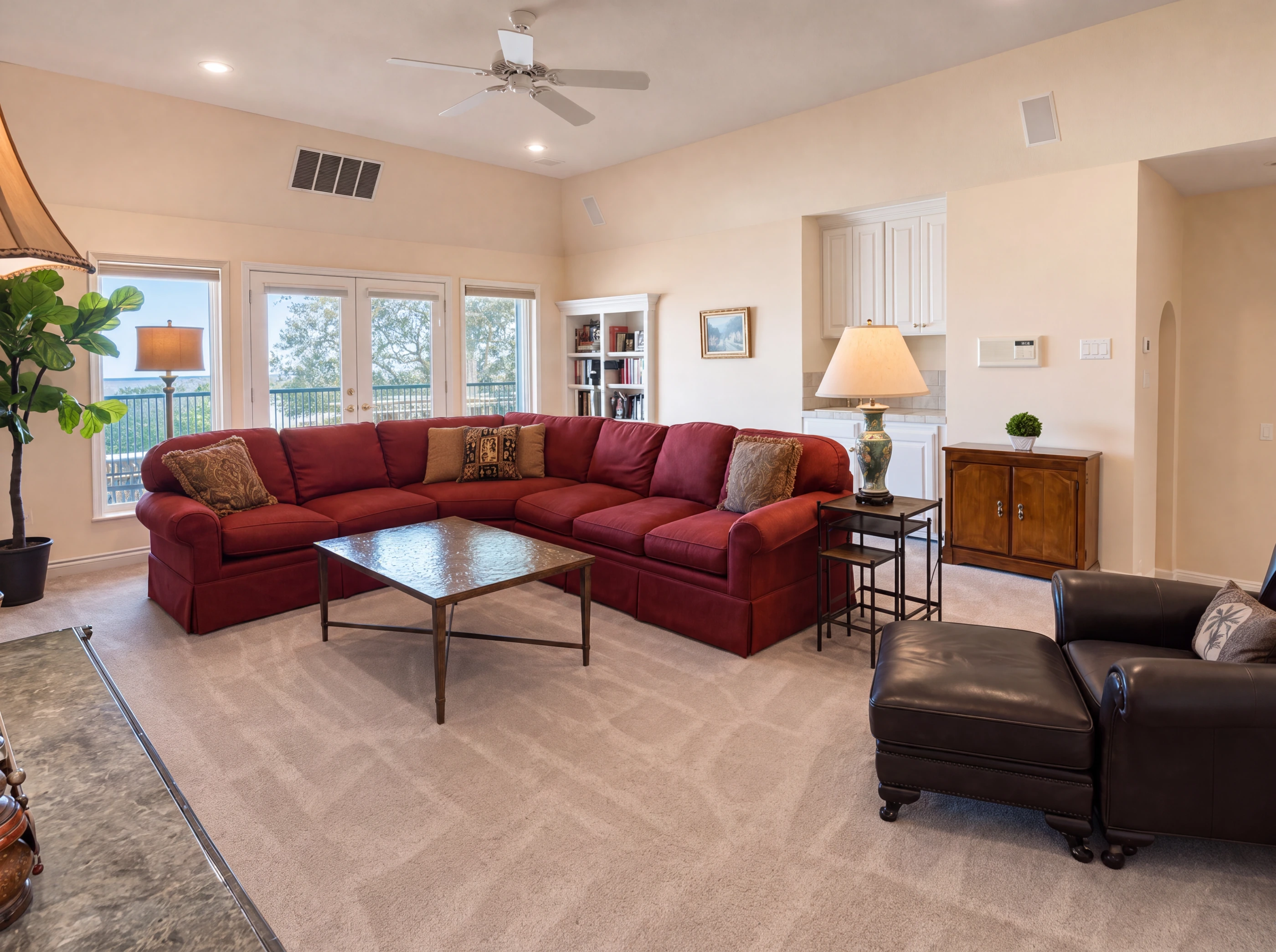 Upstairs game room with French doors to the balcony
